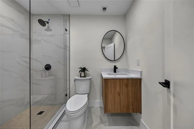 an aerial view of a house with a lake view