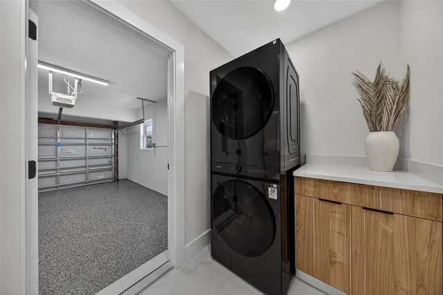 an aerial view of a houses with yard