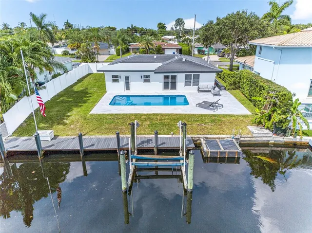 a view of a swimming pool with a lounge chairs