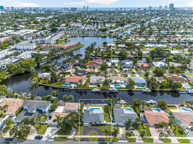 an aerial view of a houses with yard
