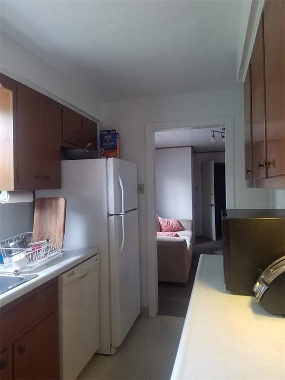 3235 Parkview Avenue Pittsburgh, PA 15213 - Photo 8 of 21 a kitchen with a refrigerator sink and cabinets
