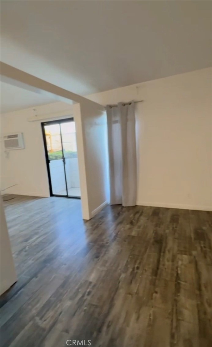 20234 Cantara Street Winnetka, CA 91306 - Photo 6 of 7 a view of an empty room and wooden floor