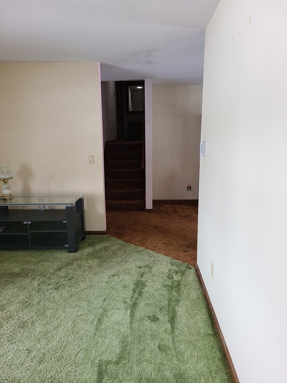 65 Lakeview Avenue Athol, MA 01331 - Photo 12 of 30 a view of a livingroom with an empty space and a hallway