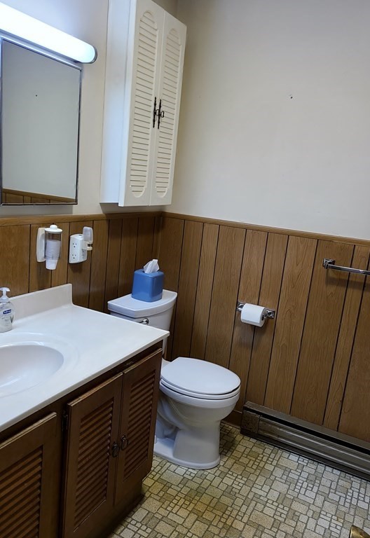 65 Lakeview Avenue Athol, MA 01331 - Photo 16 of 30 a bathroom with a sink a toilet a mirror and vanity