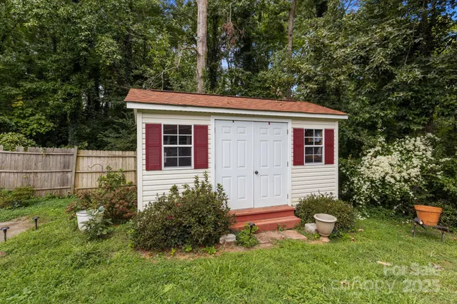 a view of backyard with a garden and entertaining space