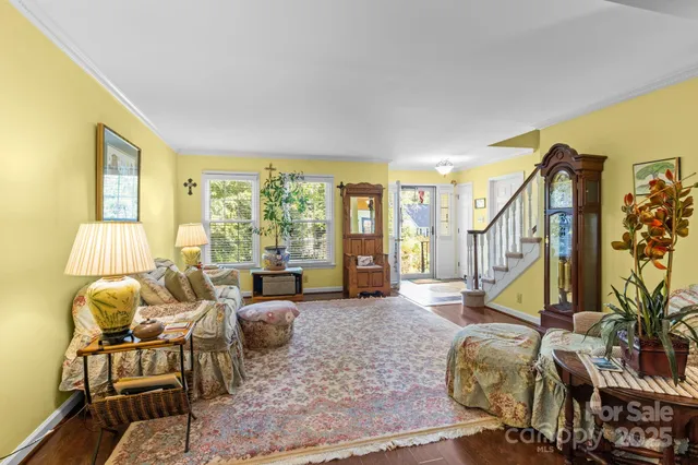 a view of a dining room with furniture and chandelier