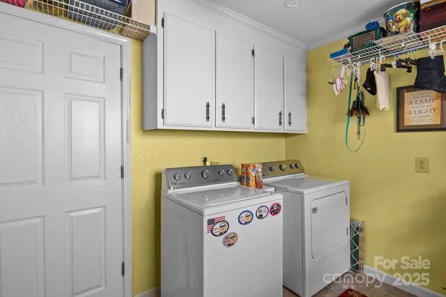 a bedroom with furniture and a large window