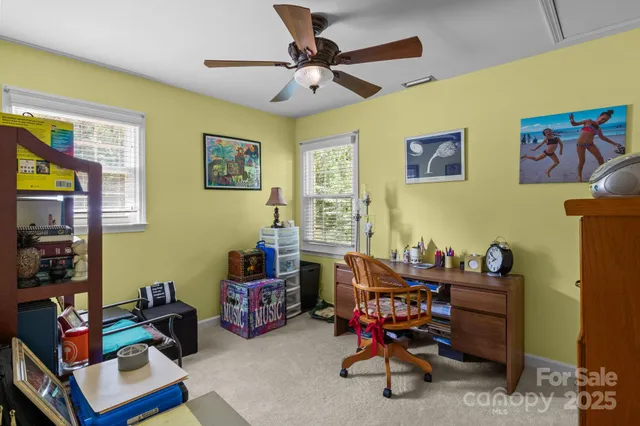 a bathroom with a sink a toilet and shower curtain