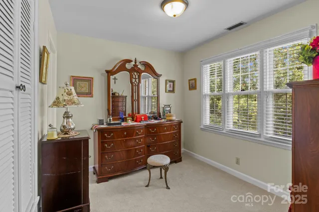 a utility room with cabinets washer and dryer