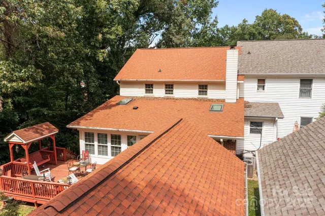 aerial view of a house with roof deck