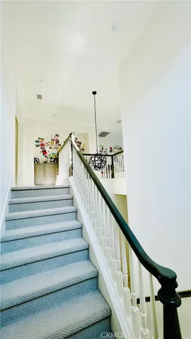 a view of a hardwood floor and chandelier
