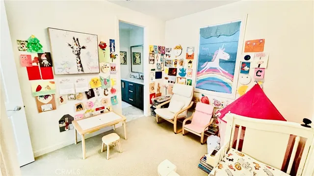 a view of a workspace with bookshelf and a window