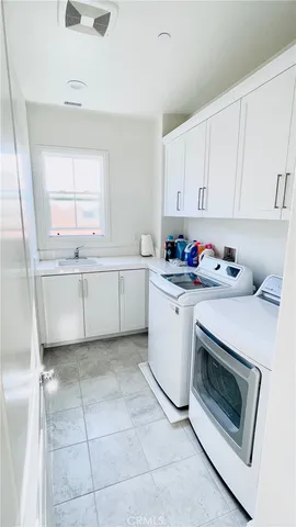 a room with a bed and wall painting