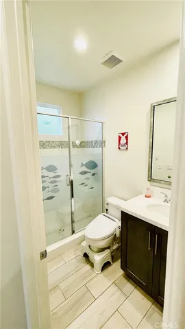 a bed room with a bed tv and a window