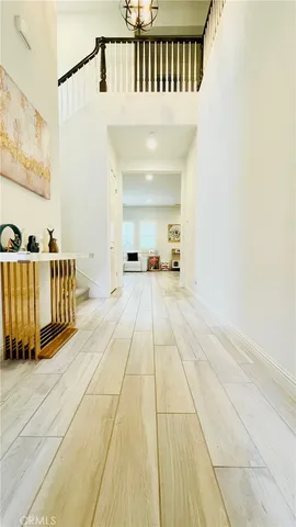 a living room with furniture and large windows