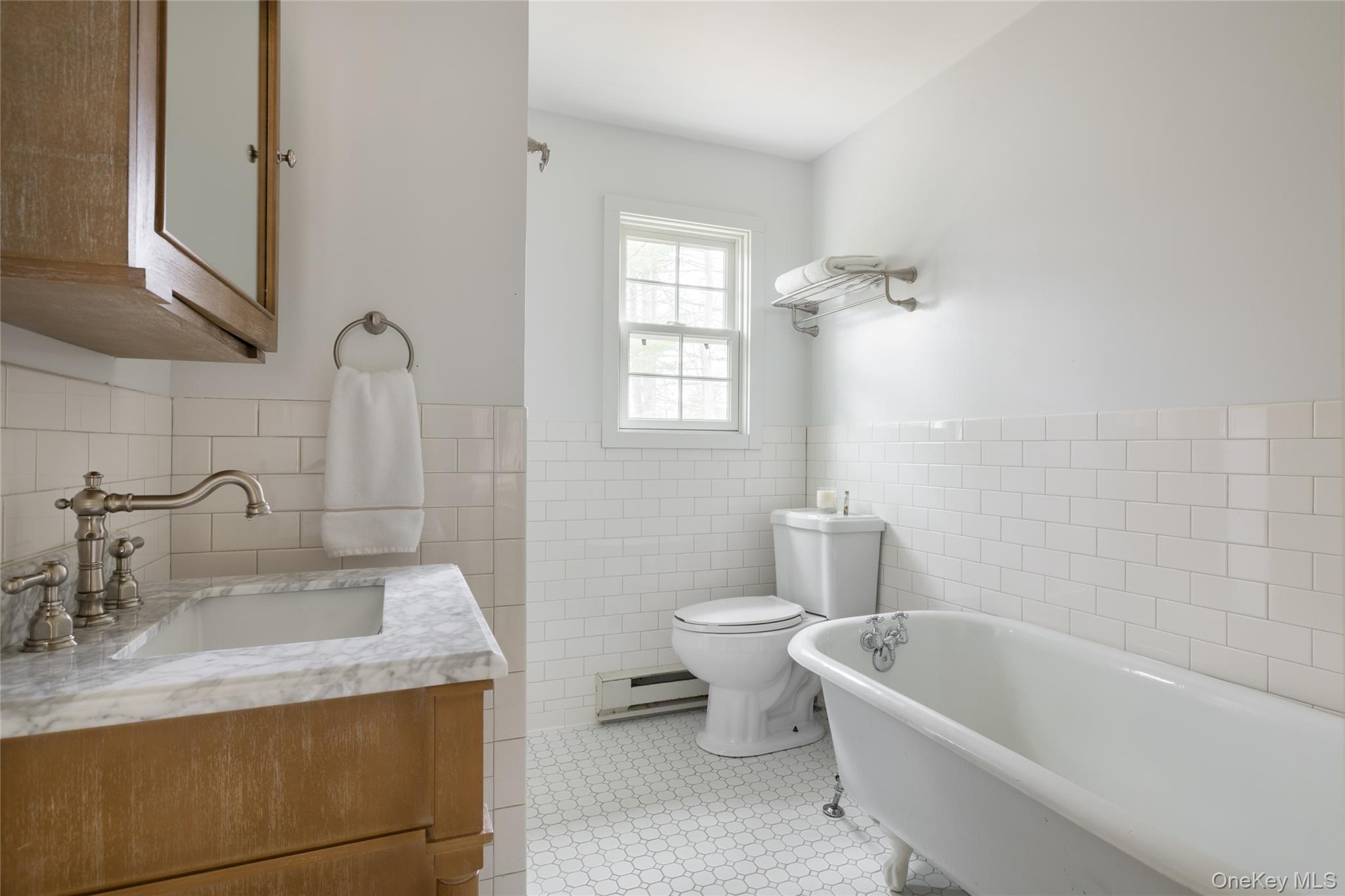 3 Corkscrew Road Barryville, NY 12719 - Photo 13 of 19 a bathroom with a granite countertop sink a toilet and bathtub