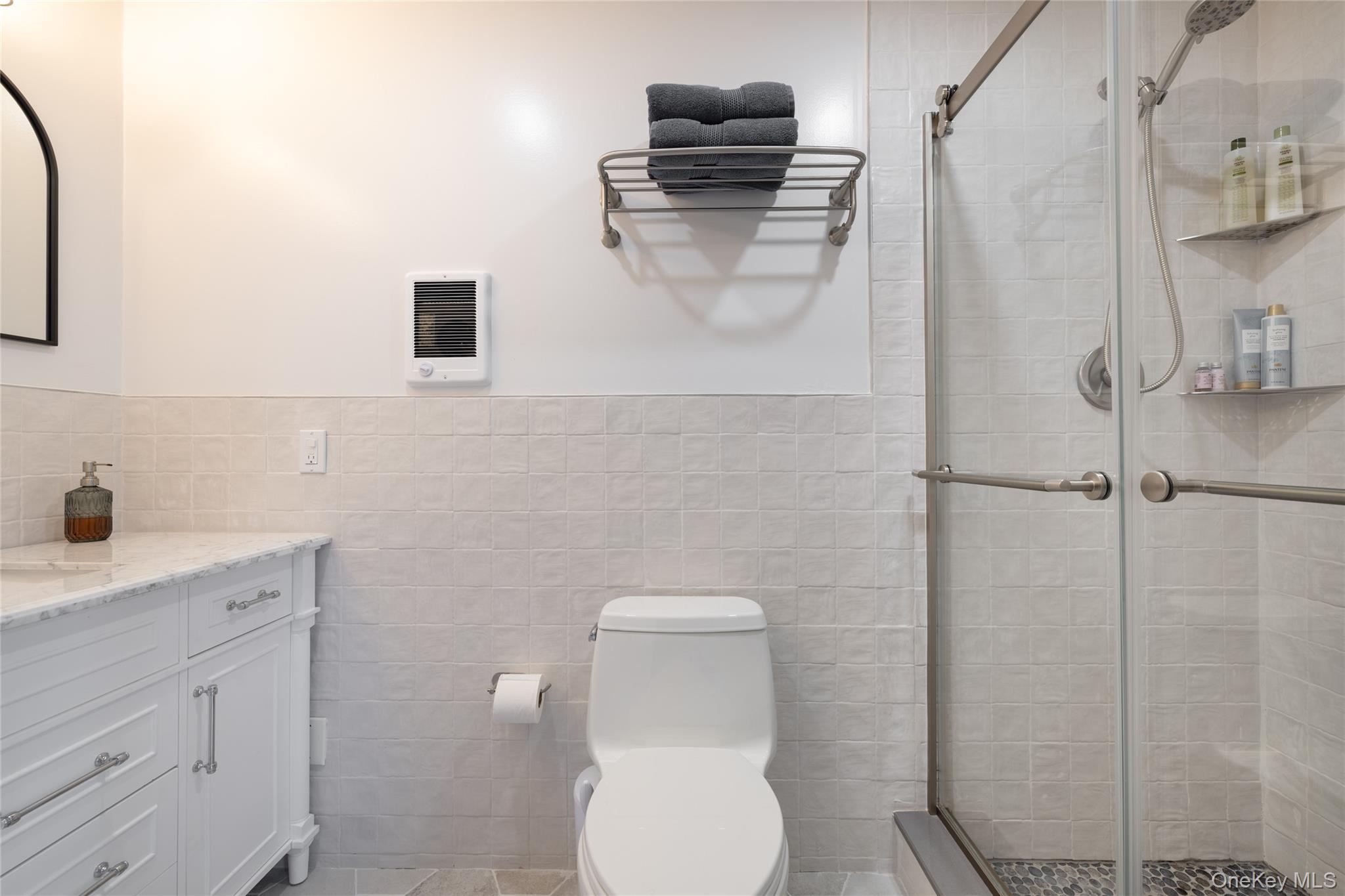 3 Corkscrew Road Barryville, NY 12719 - Photo 17 of 19 a bathroom with a toilet sink and mirror