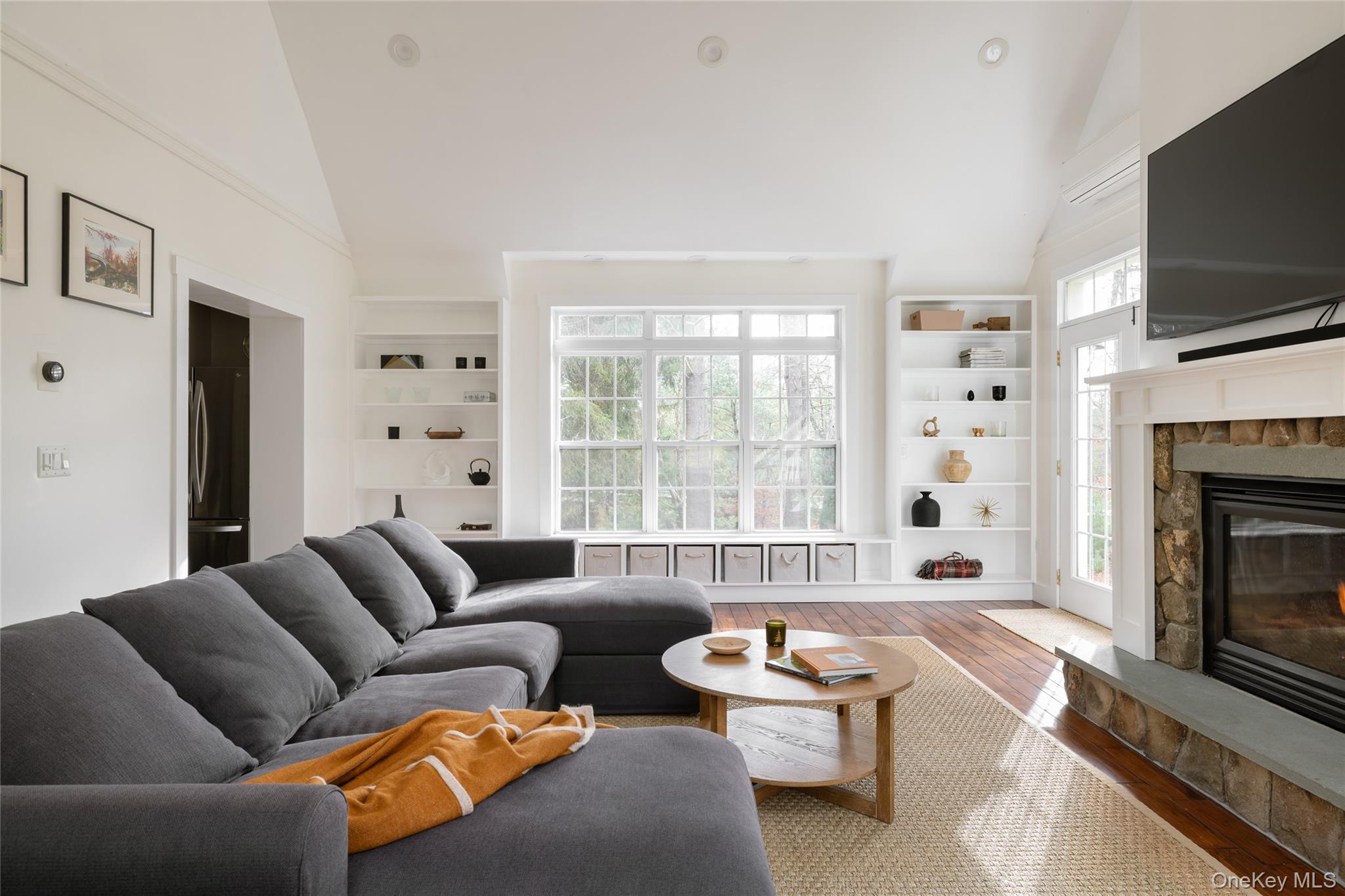 3 Corkscrew Road Barryville, NY 12719 - Photo 3 of 19 a living room with furniture a flat screen tv and a fireplace