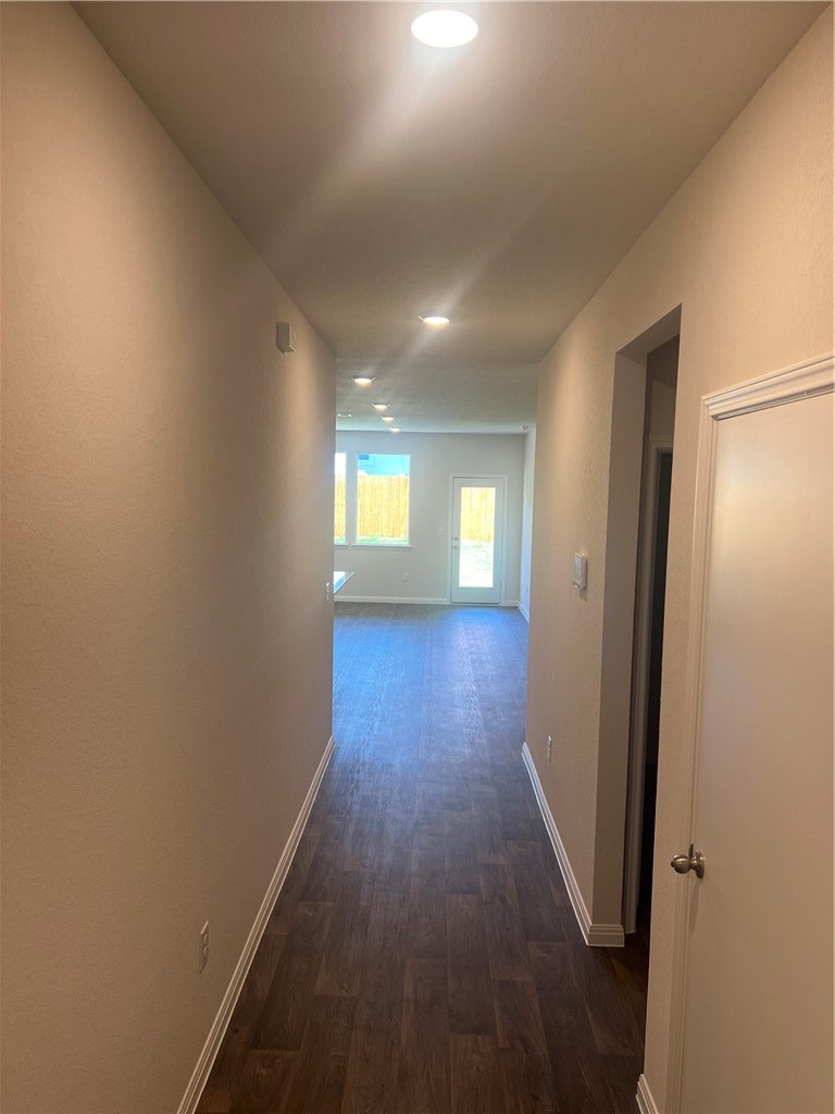 252 Sunniberg Loop Georgetown, TX 78626 - Photo 3 of 17 Entry hallway leading to large, open living room.