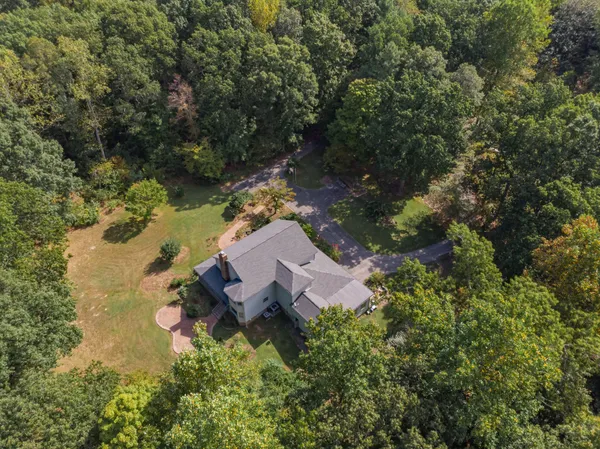 a living room with furniture and large windows