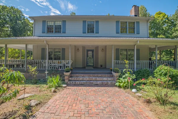a kitchen with granite countertop a stove and a sink