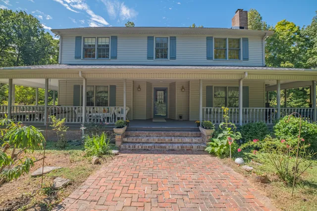a kitchen with granite countertop a stove and a sink