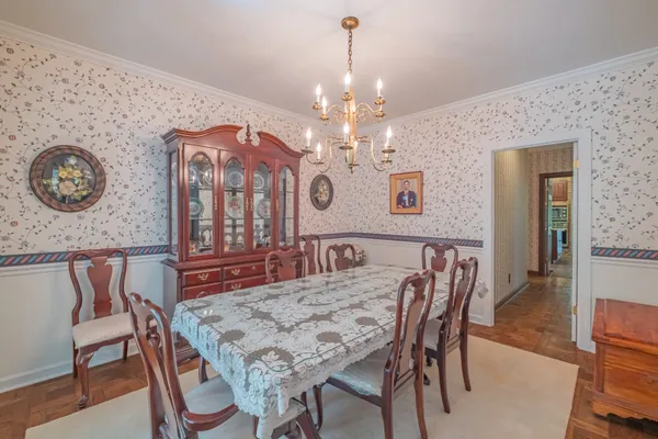 a bathroom with a granite countertop sink and a mirror with toilet
