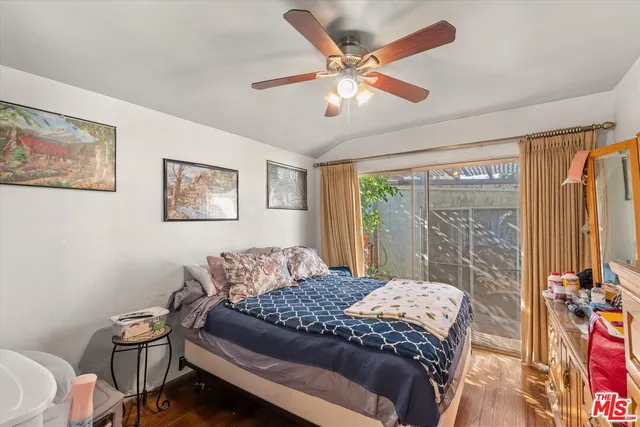 a view of a wooden chairs and table in patio