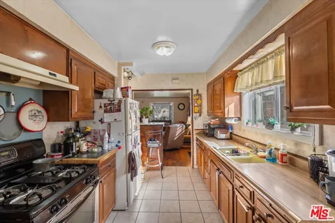 a bedroom with bed and a couch