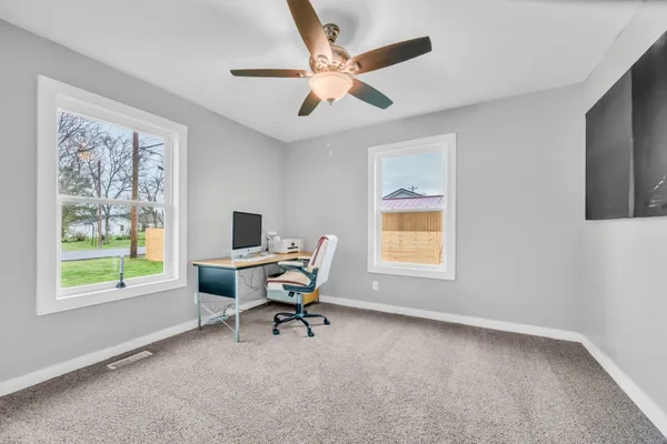 a view of a workspace with furniture