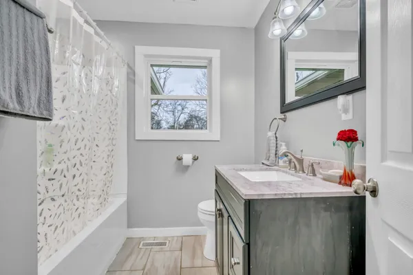a bathroom with a sink a vanity and a mirror
