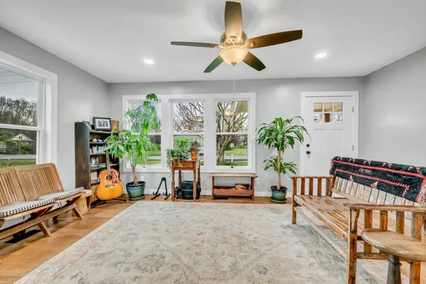 a living room with furniture and a window