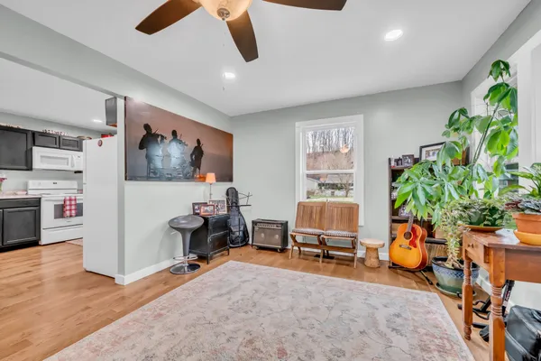 a view of a livingroom with furniture and a flat screen tv