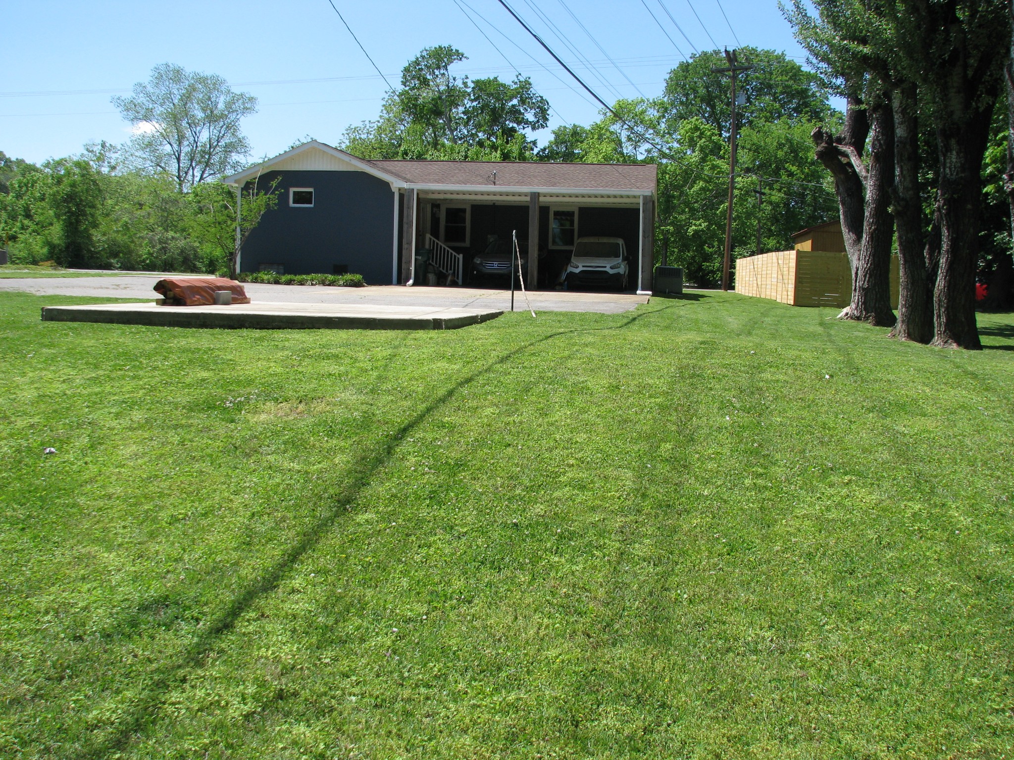 101 Simpson Street Waverly, TN 37185 - Photo 38 of 42 a view of a house with backyard and a tree