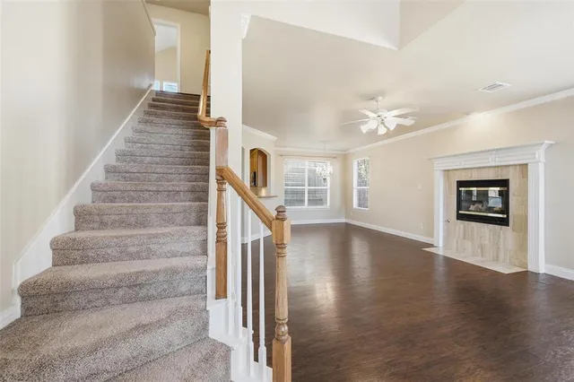 a view of an entryway with wooden floor