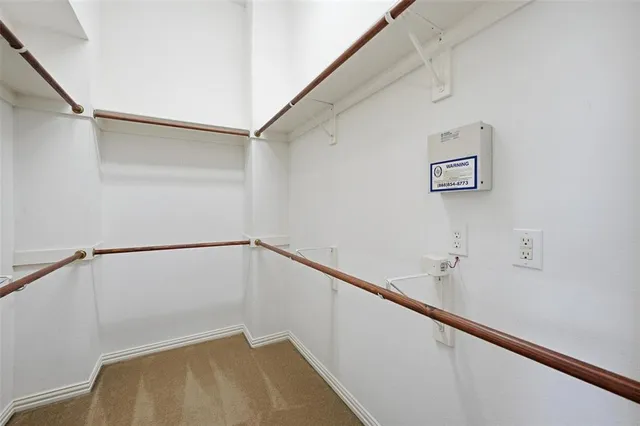a view of a hallway with stairs