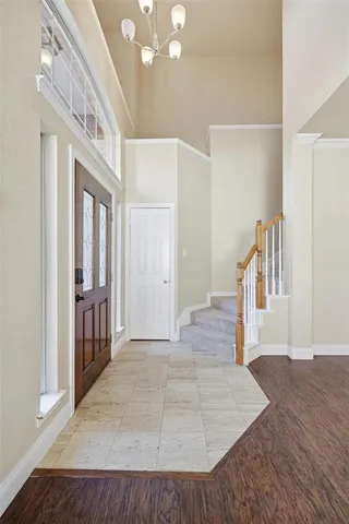 a view of an entryway with wooden floor
