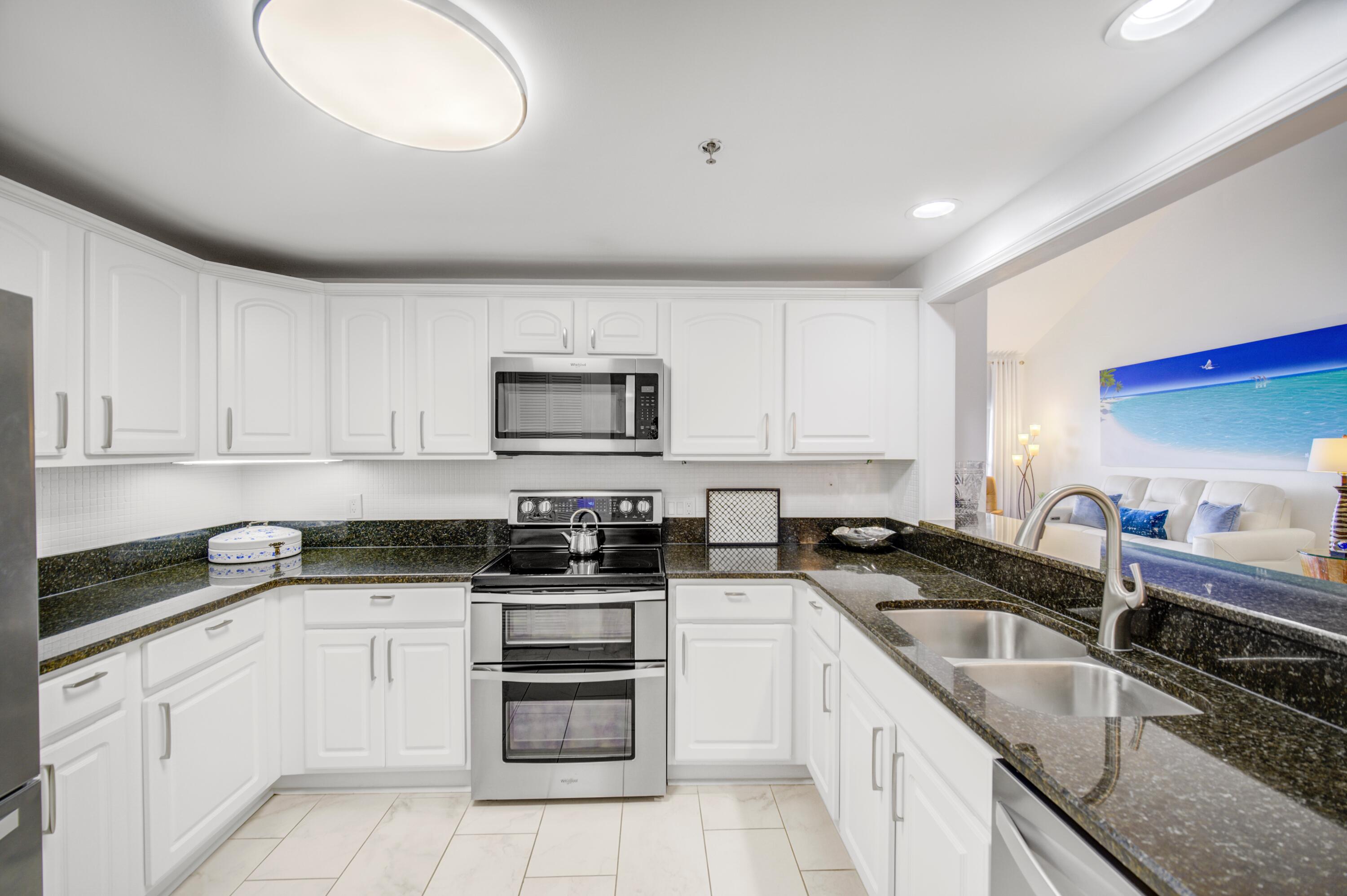 25 Players Club, Unit 25 Miramar Beach, FL 32550 - Photo 21 of 44 Kitchen and painting
