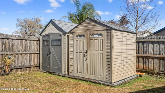 an aerial view of a house with a ocean view