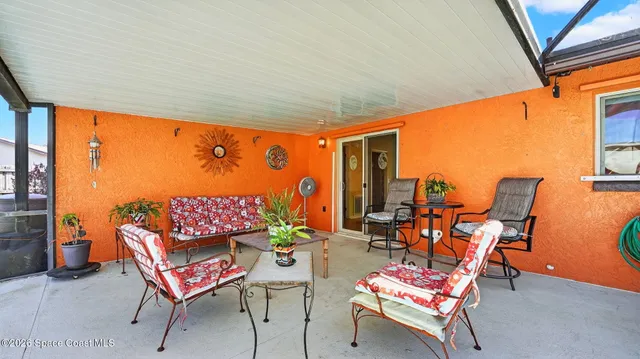 a bedroom with a bed and a table