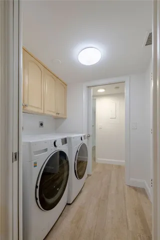 a view of storage and utility room with washer and dryer