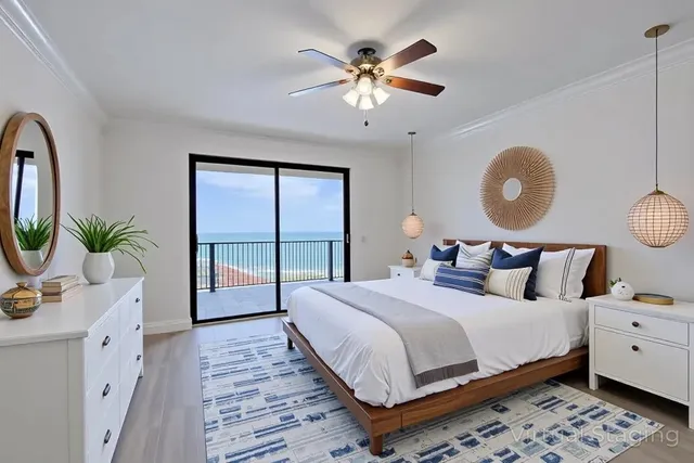 a bedroom with a large bed and a window