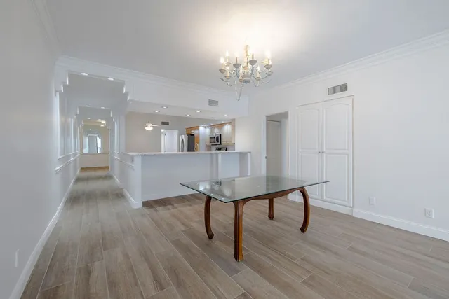 a view of a room with breakfast area and chandelier