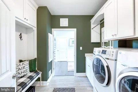 a view of a kitchen with washer and dryer