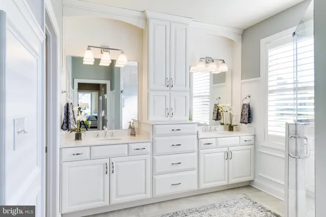 a bathroom with a sink a vanity and a mirror