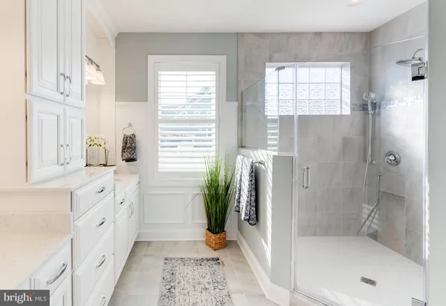 a bathroom with a bathtub and a shower