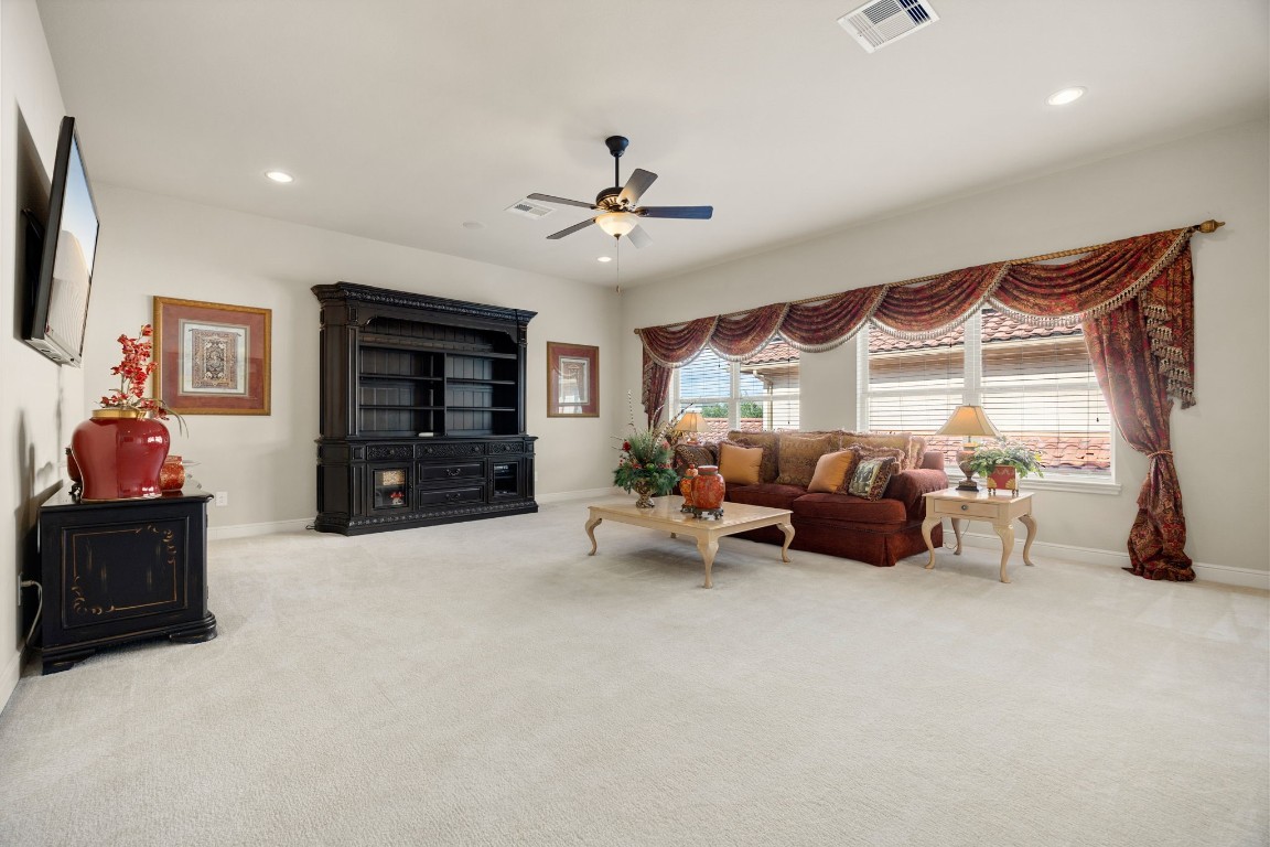 26515 Ashley Ridge Lane Katy, TX 77494 - Photo 38 of 50 a living room with furniture and a flat screen tv