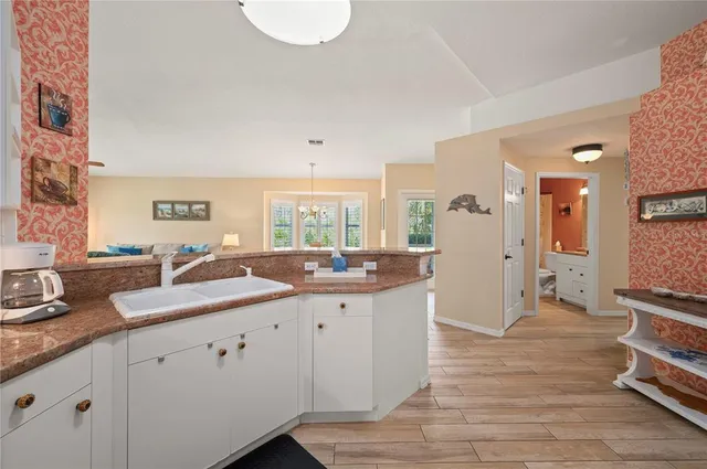 a bedroom with a bed and a chair