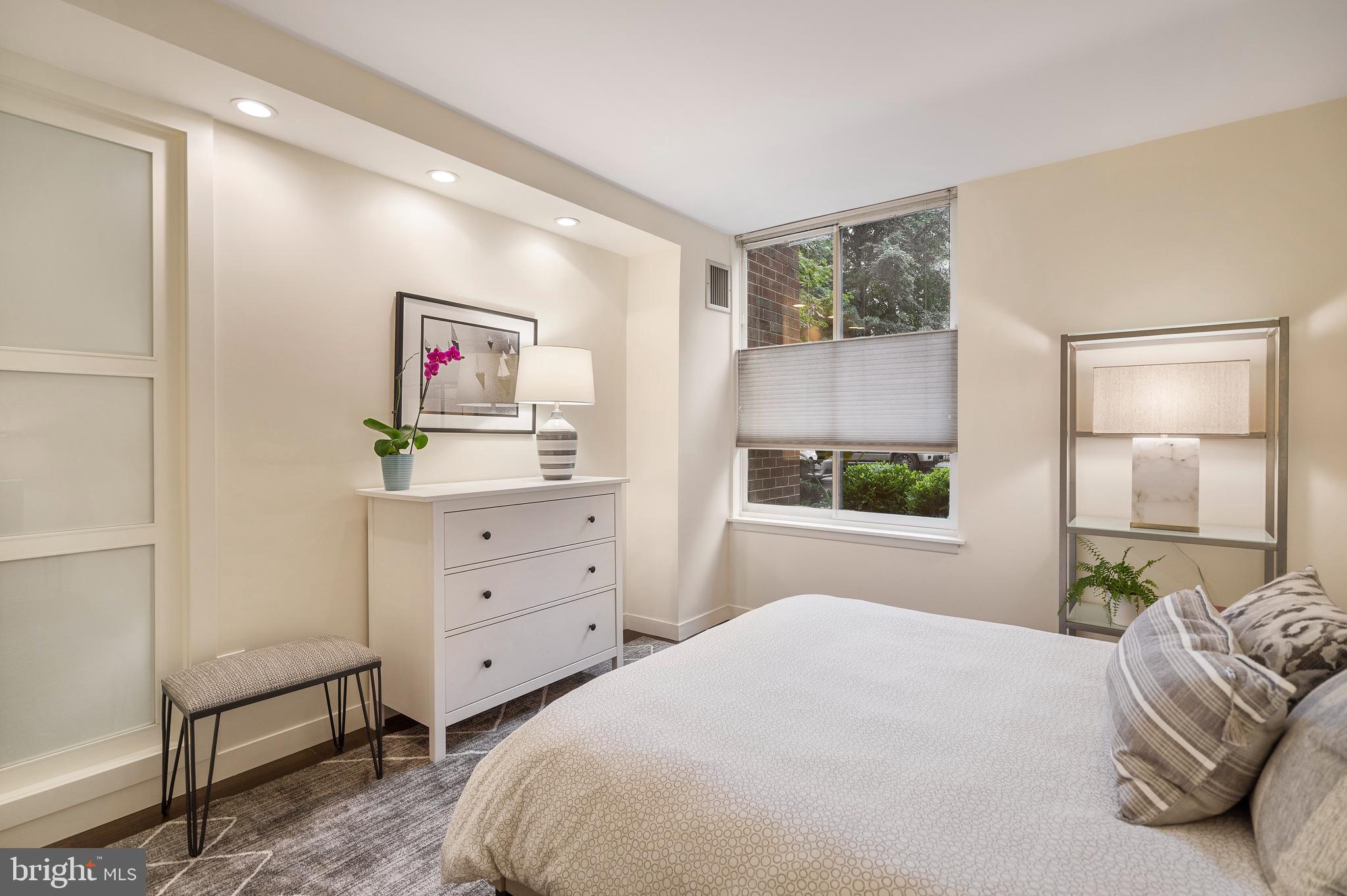1301 20th Street Northwest, Unit 109 Washington, DC 20036 - Photo 17 of 33 a bedroom with a bed and a window