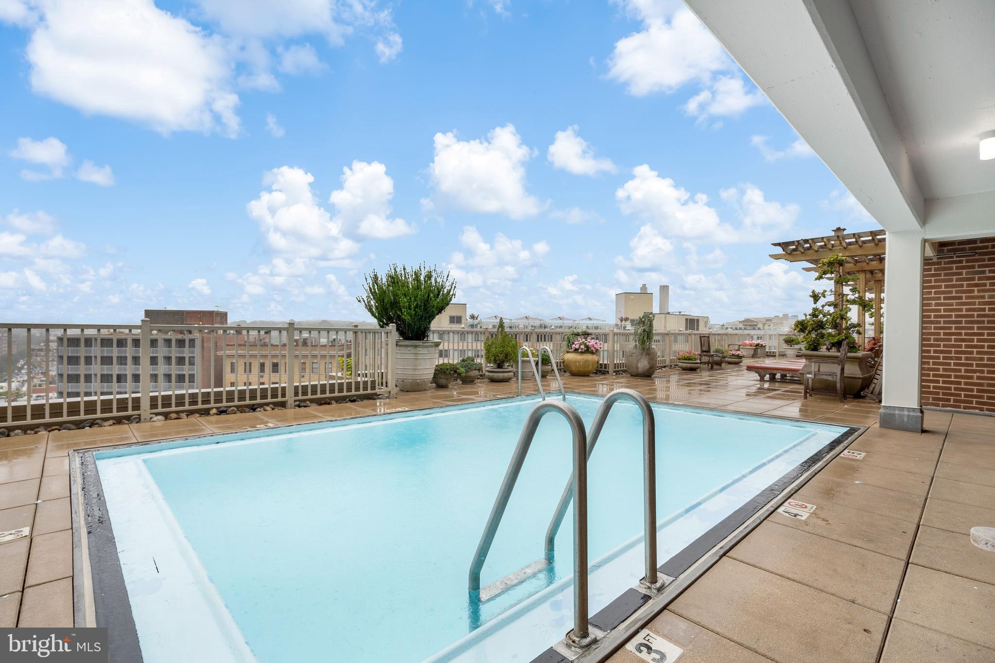 1301 20th Street Northwest, Unit 109 Washington, DC 20036 - Photo 25 of 33 a view of a swimming pool with a terrace